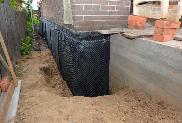 Happy homeowners after waterproofing job in Wilberforce